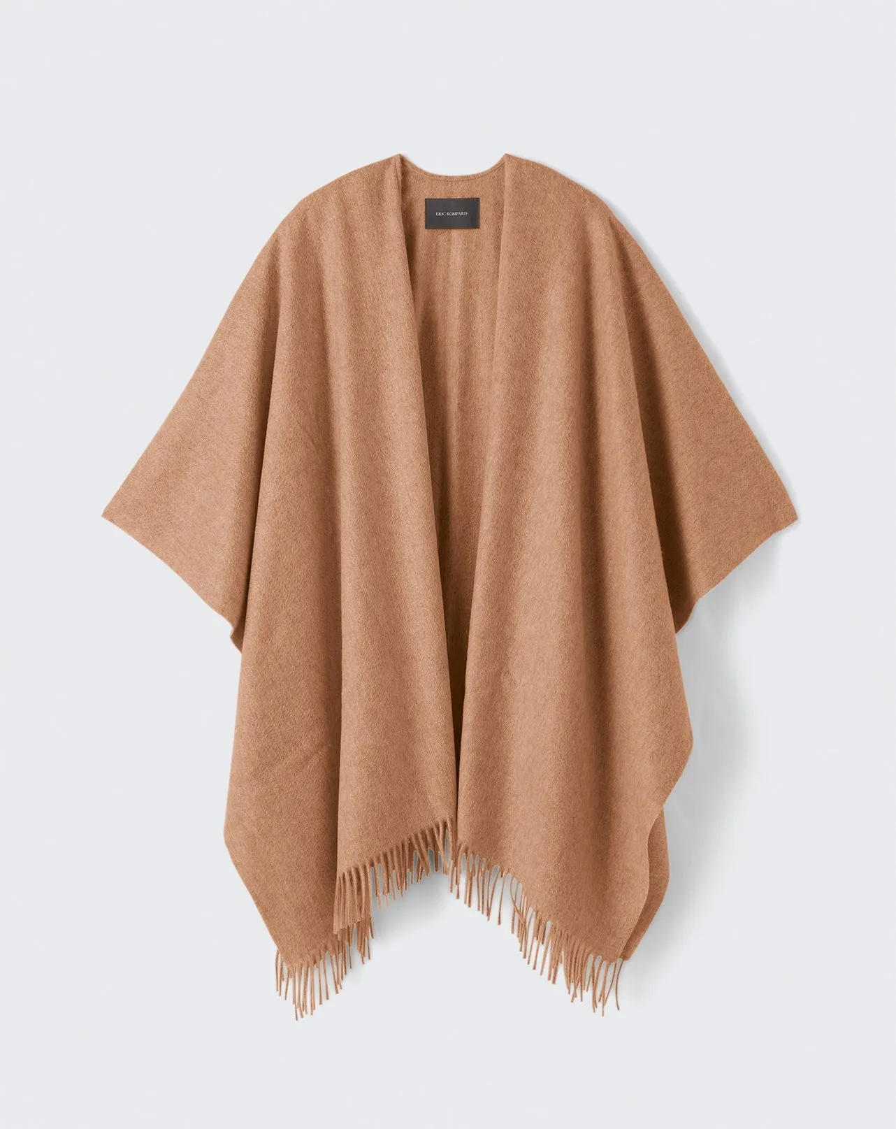 Poncho tissé à franges